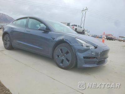 Czwarte zdjęcie samochodu z boku: 2023 TESLA MODEL 3 VIN:5YJ3E1EA0PF397095 - miniatura