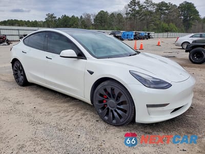 Czwarte zdjęcie samochodu z boku: 2022 TESLA MODEL 3 VIN:5YJ3E1EC8NF269671 - miniatura