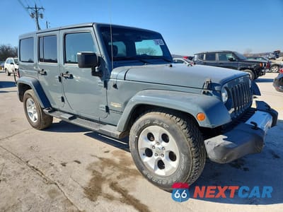 Czwarte zdjęcie samochodu z boku: 2014 JEEP WRANGLER UNLIMITED SAHARA VIN:1C4BJWEG0EL196980 - miniatura