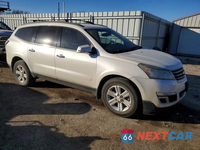 Czwarte zdjęcie samochodu z boku: 2014 CHEVROLET TRAVERSE LT VIN:1GNKRGKD7EJ329732 - miniatura