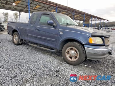 Czwarte zdjęcie samochodu z boku: 2002 FORD F-150 VIN:1FTRX17W22NB57005 - miniatura