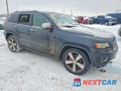 Czwarte zdjęcie samochodu z boku: 2014 JEEP GRAND CHEROKEE OVERLAND VIN:1C4RJFCG6EC181367 - miniatura