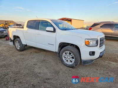 Czwarte zdjęcie samochodu z boku: 2019 GMC CANYON SLE VIN:1GTG6CENXK1142761 - miniatura