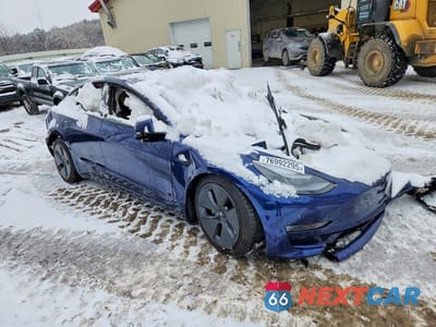 Czwarte zdjęcie samochodu z boku: 2022 TESLA MODEL 3 VIN:5YJ3E1EB5NF182401 - miniatura