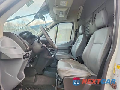 Zdjęcie 7 z 13 samochodu: 2016 FORD TRANSIT T-150 VIN:1FTYE2CM2GKA94413 - miniatura