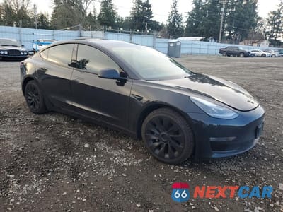 Czwarte zdjęcie samochodu z boku: 2022 TESLA MODEL 3 VIN:5YJ3E1EB5NF108105 - miniatura
