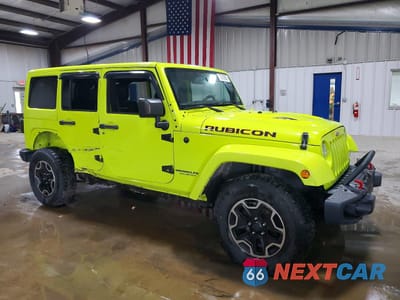 Czwarte zdjęcie samochodu z boku: 2016 JEEP WRANGLER UNLIMITED RUBICON VIN:1C4BJWFG4GL320752 - miniatura