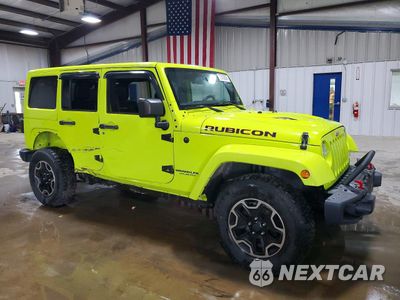 Czwarte zdjęcie samochodu z boku: 2016 JEEP WRANGLER UNLIMITED RUBICON VIN:1C4BJWFG4GL320752 - miniatura