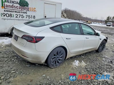 Trzecie zdjęcie samochodu z tyłu: 2022 TESLA MODEL 3 VIN:5YJ3E1EB0NF316599 - miniatura