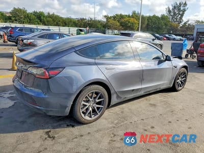 Trzecie zdjęcie samochodu z tyłu: 2023 TESLA MODEL 3 VIN:5YJ3E1EA7PF383405 - miniatura