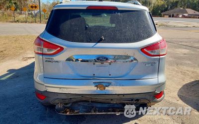 Czwarte zdjęcie samochodu z boku: 2016 FORD ESCAPE TITANIUM VIN:1FMCU9JXXGUC33190 - miniatura