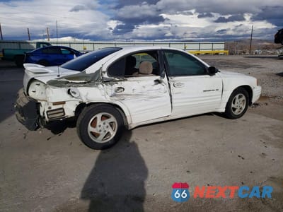Trzecie zdjęcie samochodu z tyłu: 1999 PONTIAC GRAND AM SE VIN:1G2NE52E2XC508402 - miniatura