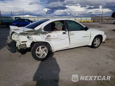 Trzecie zdjęcie samochodu z tyłu: 1999 PONTIAC GRAND AM SE VIN:1G2NE52E2XC508402 - miniatura