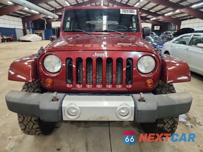 Piąte zdjęcie samochodu w środku: 2010 JEEP WRANGLER SAHARA VIN:1J4AA5D11AL154583 - miniatura