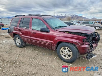 Czwarte zdjęcie samochodu z boku: 2001 JEEP GRAND CHEROKEE LIMITED VIN:1J4GW58NX1C739980 - miniatura