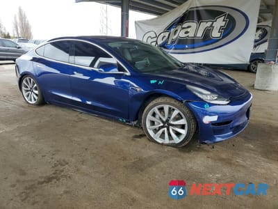 Czwarte zdjęcie samochodu z boku: 2018 TESLA MODEL 3 VIN:5YJ3E1EB5JF115985 - miniatura