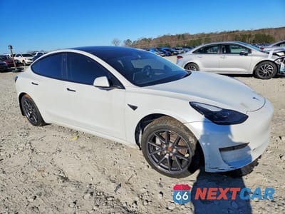 Czwarte zdjęcie samochodu z boku: 2022 TESLA MODEL 3 VIN:5YJ3E1EA0NF311183 - miniatura