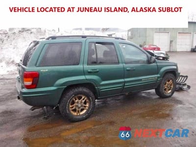 Trzecie zdjęcie samochodu z tyłu: 1999 JEEP GRAND CHEROKEE LIMITED VIN:1J4GW68N3XC639363 - miniatura