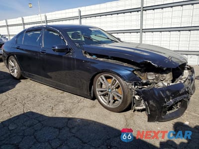 Czwarte zdjęcie samochodu z boku: 2017 BMW 740 I VIN:WBA7E2C52HG739597 - miniatura