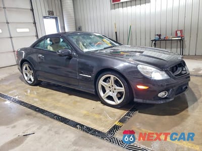Czwarte zdjęcie samochodu z boku: 2009 MERCEDES-BENZ SL 550 VIN:WDBSK71F69F150427 - miniatura