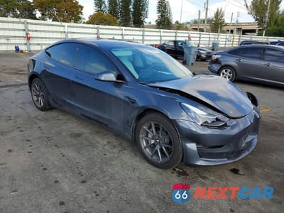 Czwarte zdjęcie samochodu z boku: 2023 TESLA MODEL 3 VIN:5YJ3E1EA7PF383405 - miniatura