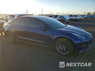 Czwarte zdjęcie samochodu z boku: 2021 TESLA MODEL 3 VIN:5YJ3E1EA1MF868277 - miniatura