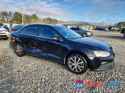 Czwarte zdjęcie samochodu z boku: 2017 VOLKSWAGEN JETTA SE VIN:3VWDB7AJ8HM296354 - miniatura