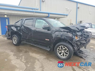 Czwarte zdjęcie samochodu z boku: 2018 GMC CANYON SLT VIN:1GTG6DEN0J1285058 - miniatura