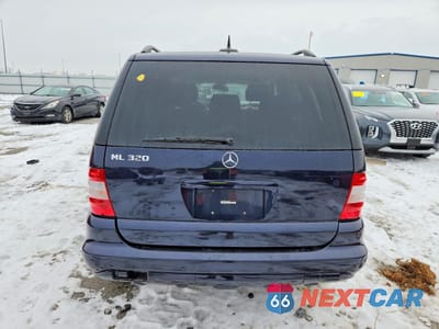 Zdjęcie 6 z 13 samochodu: 2002 MERCEDES-BENZ ML 320 VIN:4JGAB54E92A348325 - miniatura