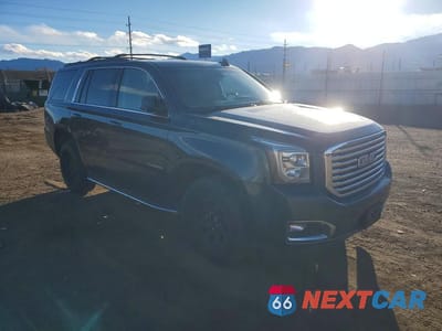 Czwarte zdjęcie samochodu z boku: 2019 GMC YUKON SLT VIN:1GKS2BKCXKR189555 - miniatura