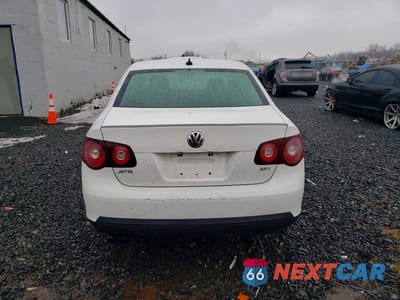 Zdjęcie 6 z 11 samochodu: 2010 VOLKSWAGEN JETTA WOLFSBURG VIN:3VWRA7AJ1AM100057 - miniatura