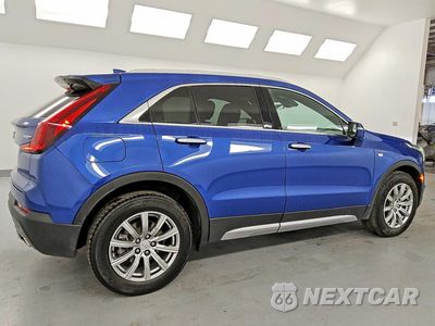 Trzecie zdjęcie samochodu z tyłu: 2023 CADILLAC XT4 PREMIUM LUXURY VIN:1GYFZCR47PF147411 - miniatura