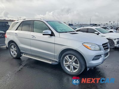 Czwarte zdjęcie samochodu z boku: 2015 MERCEDES-BENZ ML 350 VIN:4JGDA5JB3FA512460 - miniatura