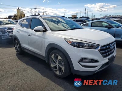 Czwarte zdjęcie samochodu z boku: 2016 HYUNDAI TUCSON LIMITED VIN:KM8J33A20GU253072 - miniatura