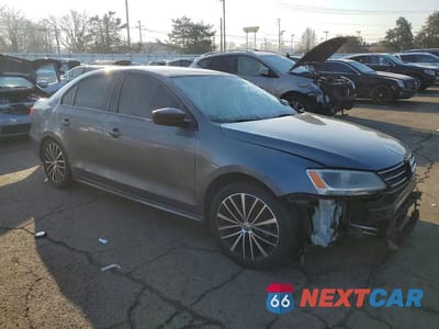 Czwarte zdjęcie samochodu z boku: 2016 VOLKSWAGEN JETTA SPORT VIN:3VWD17AJ3GM259410 - miniatura