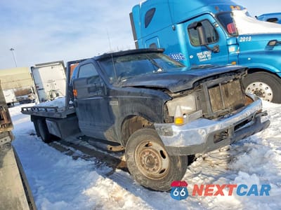 Czwarte zdjęcie samochodu z boku: 1999 FORD F450 SUPER DUTY ROLLBACK TRUCK VIN:1FDXF46F1XEE96130 - miniatura