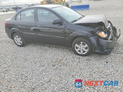 Czwarte zdjęcie samochodu z boku: 2010 KIA RIO LX VIN:KNADH4A34A6613356 - miniatura