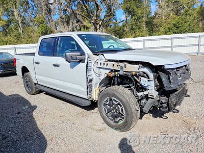 Czwarte zdjęcie samochodu z boku: 2023 FORD F150 LIGHTNING PRO VIN:1FTVW1EL2PWG61906 - miniatura