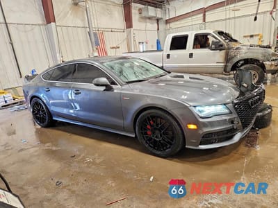 Czwarte zdjęcie samochodu z boku: 2014 AUDI A7 PRESTIGE VIN:WAU2GAFCXEN104434 - miniatura