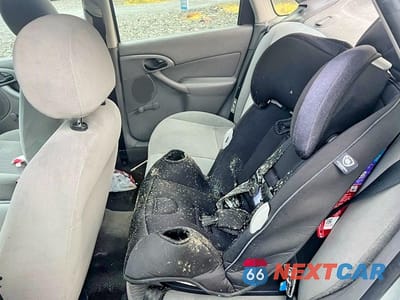 Zdjęcie 10 z 13 samochodu: 2001 FORD FOCUS LX VIN:1FAFP33P71W151227 - miniatura