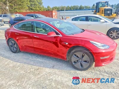 Czwarte zdjęcie samochodu z boku: 2018 TESLA MODEL 3 VIN:5YJ3E1EA4JF007090 - miniatura