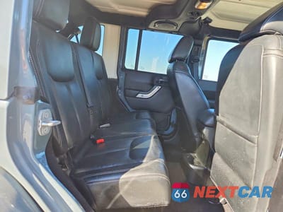 Zdjęcie 11 z 13 samochodu: 2014 JEEP WRANGLER UNLIMITED SAHARA VIN:1C4BJWEG0EL196980 - miniatura