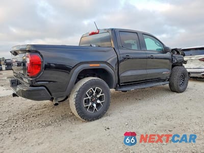 Trzecie zdjęcie samochodu z tyłu: 2024 GMC CANYON AT4X VIN:1GTP6EEKXR1186237 - miniatura