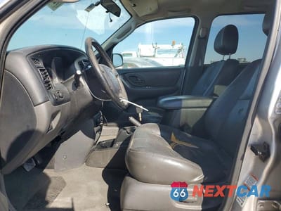 Zdjęcie 7 z 13 samochodu: 2003 MAZDA TRIBUTE VIN:4F2CZ06103KM32258 - miniatura