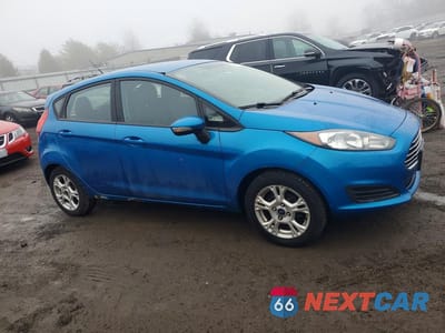 Czwarte zdjęcie samochodu z boku: 2015 FORD FIESTA SE VIN:3FADP4EJ3FM208374 - miniatura