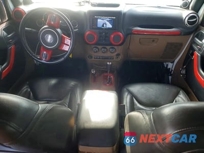 Zdjęcie 8 z 12 samochodu: 2014 JEEP WRANGLER UNLIMITED SAHARA VIN:1C4HJWEGXEL262428 - miniatura