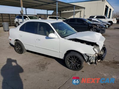 Czwarte zdjęcie samochodu z boku: 2003 HYUNDAI ACCENT GL VIN:KMHCG45CX3U423230 - miniatura