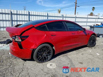 Trzecie zdjęcie samochodu z tyłu: 2022 TESLA MODEL 3 VIN:5YJ3E1EB7NF286369 - miniatura