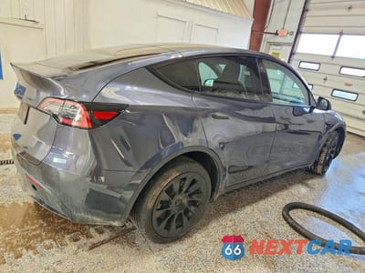 Trzecie zdjęcie samochodu z tyłu: 2023 TESLA MODEL Y VIN:7SAYGDEE7PA034703 - miniatura