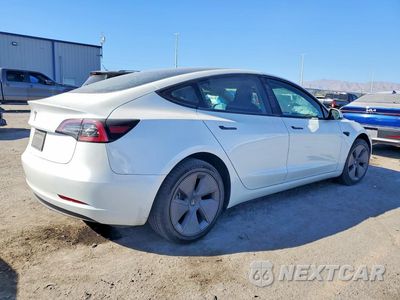 Trzecie zdjęcie samochodu z tyłu: 2023 TESLA MODEL 3 VIN:5YJ3E1EA2PF490782 - miniatura